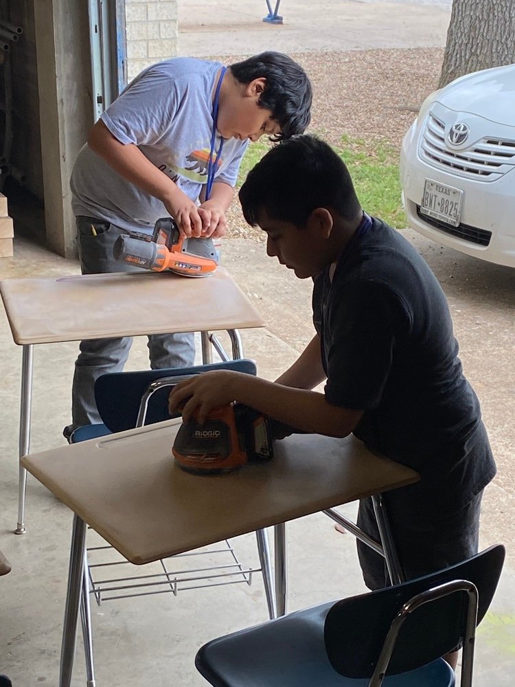 Royal Junior High principal Marcus McLemore asked his school’s general trades class to repair the desks that had graffiti. The students rose to the challenge and refurbished 40 desks in three days